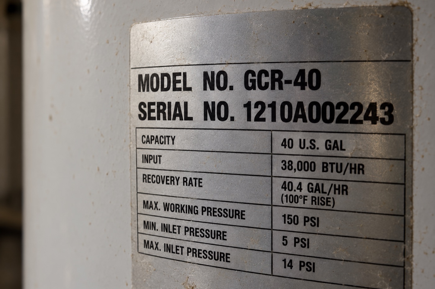 Rating label on a water heater with serial number 1210A002243 highlighted